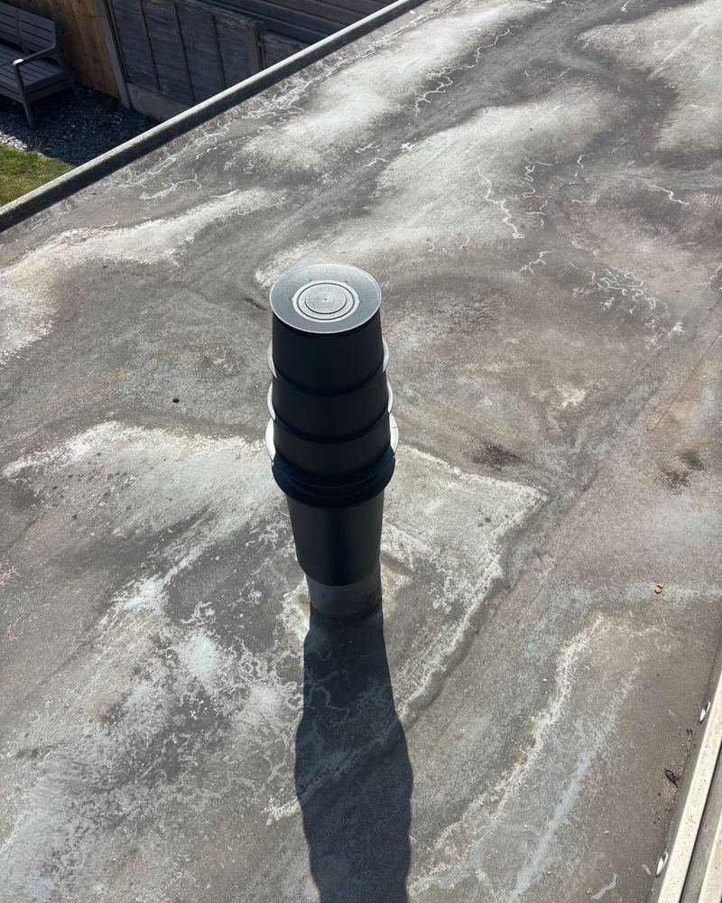 Vertical boiler flue on a flat roof